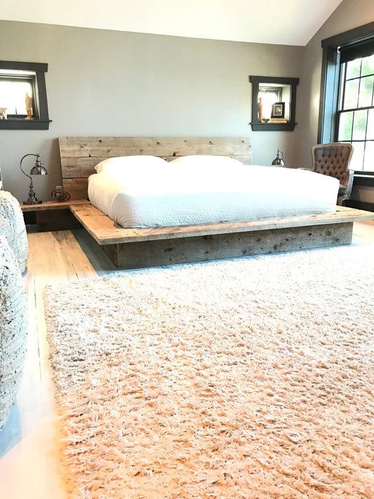 Reclaimed wood platform bed base with nighstands and elongated angled solid wood headboard back rest